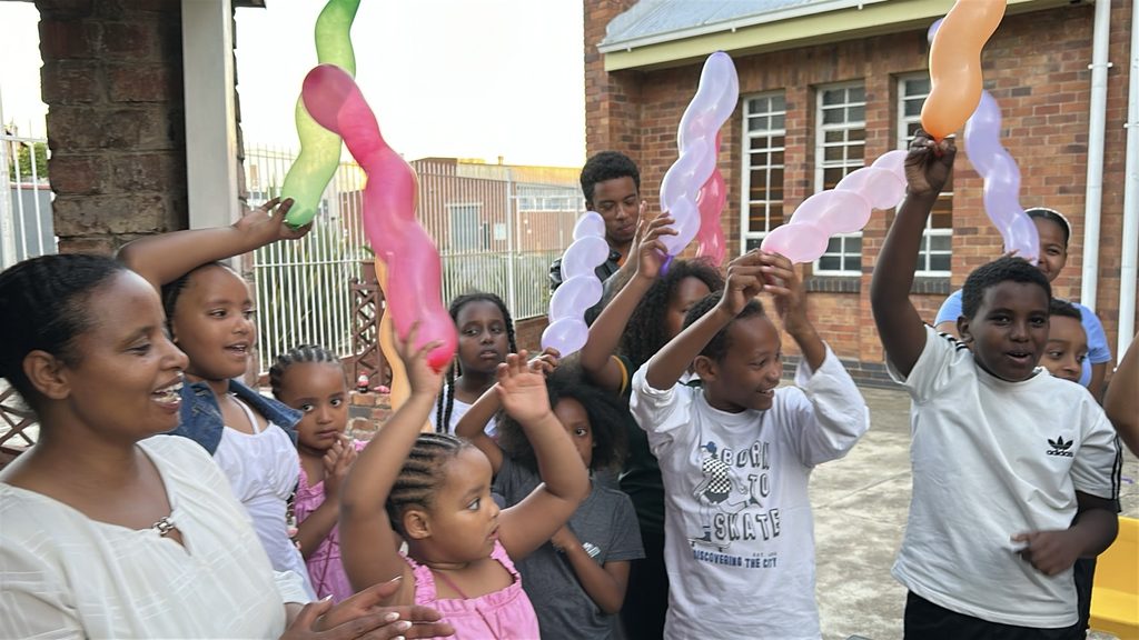 Children and young people participating in a Family Matters Global community outreach activity