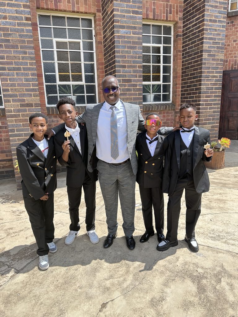 Family Matters Global facilitator with young participants after a youth development activity